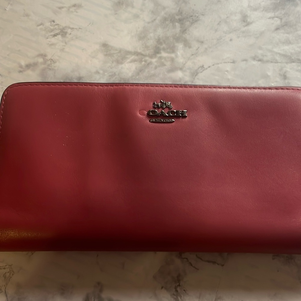 Maroon coach wallet.
